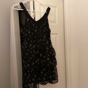 Black mini dress with ruffles.